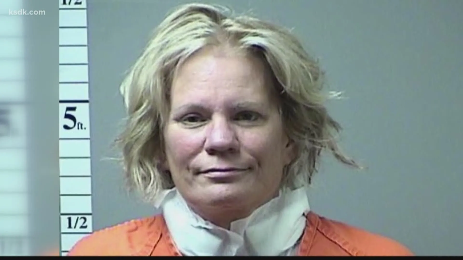 Pam Hupp in a booking photo, wearing an orange jail uniform