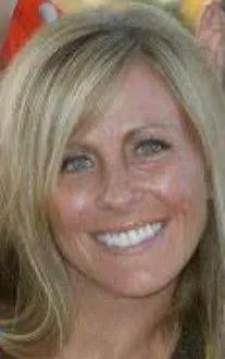 Andrea Kruger smiling, with long blonde hair