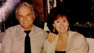 Ron Rudin and Margaret Rudin sitting together and smiling